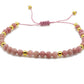 selection zen bracelet réglable perles à facettes 4mm rhodonite et perles dorées 3mm sur cordon rose